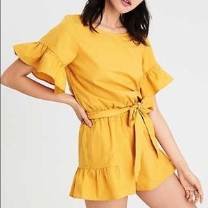 Yellow open-backed ruffled romper
